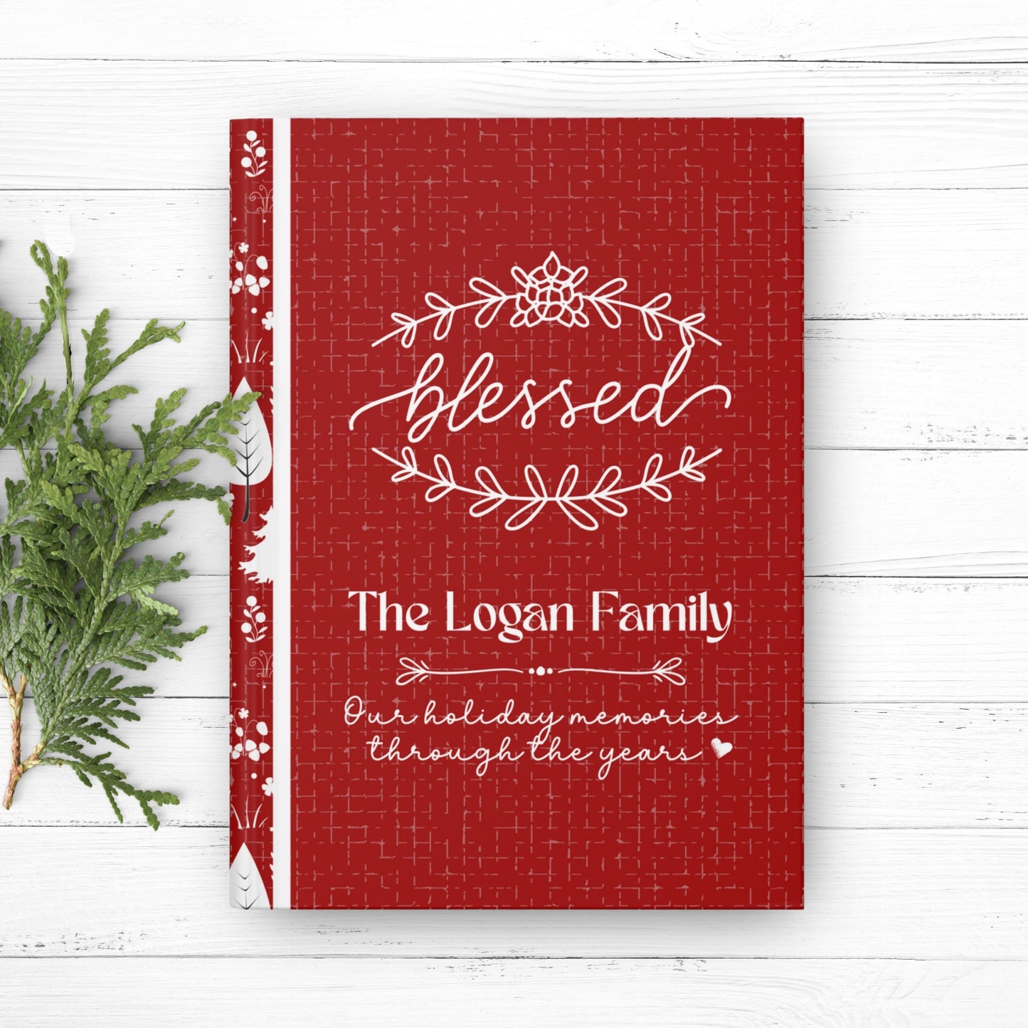 Red and White Christmas journal, with pretty wreath graphic and cursive lettering that says Blessed. Journal is personalized with family last name and the message Our Holiday Memories Through the Years. Beautiful custom Christmas gift for mom.